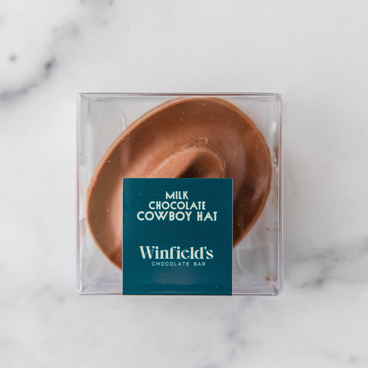 Winfield's Milk Chocolate Cowboy Hat in a clear gift box with a teal label