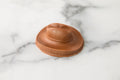 Winfield's molded milk chocolate cowboy hat photographed from a low angle on marble