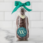 Winfield's molded chocolate cowboy bagged in cellophane with a green ribbon and the Winfield's seal