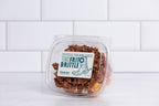 Small clear tub of Winfield's Texas Frito Brittle