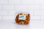 Wide clear tub of Winfield's Texas Frito Brittle