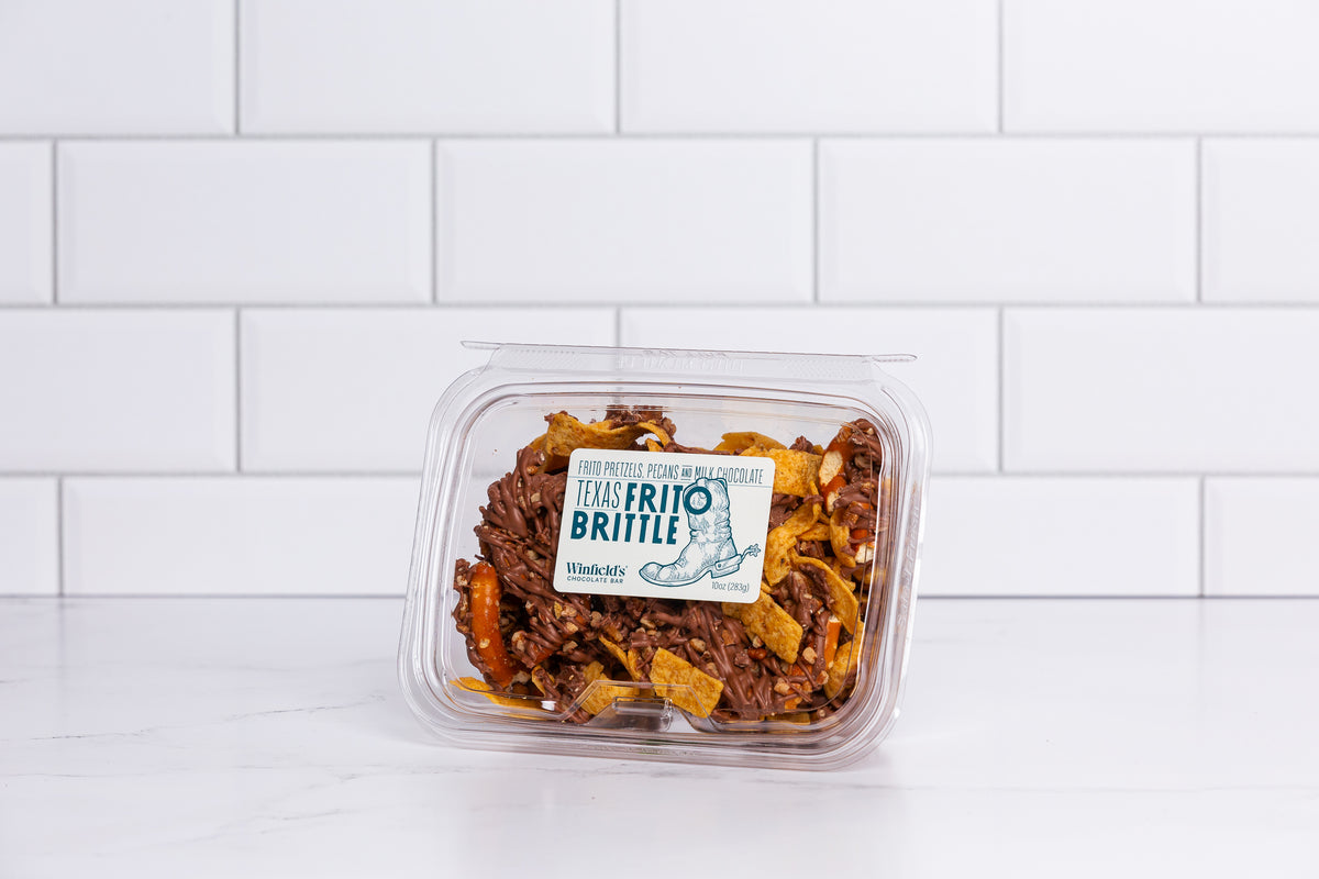 Wide clear tub of Winfield's Texas Frito Brittle