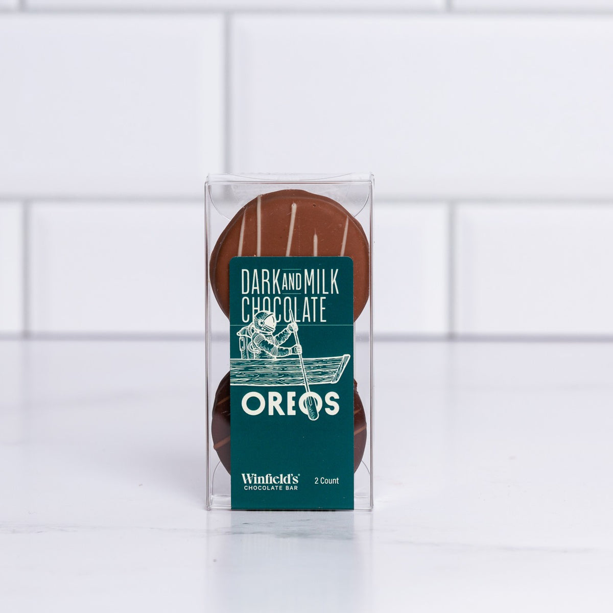 Winfield's Chocolate Covered Oreos 2-count box in dark and milk chocolate, shown through the clear window