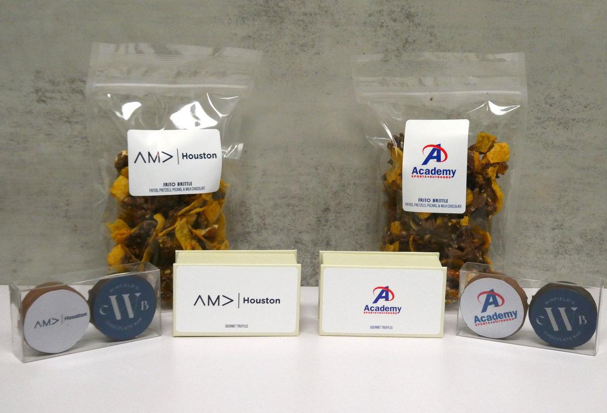 Corporate gift sets branded for AMD Houston and Academy: snack bags, printed boxes and logo chocolate coins