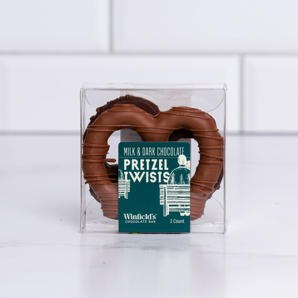 Winfield's Pretzel Twists 2-count box in milk and dark chocolate, shown through the clear window
