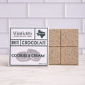 Winfield's White Chocolate Cookies & Cream bar in its wrapper beside the unwrapped bar