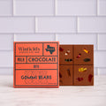Winfield's Milk Chocolate with Gummi Bears bar in its orange wrapper beside the unwrapped bar studded with gummy bears