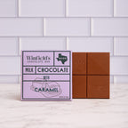 Winfield's Milk Chocolate with Caramel bar in its lilac wrapper beside the unwrapped bar