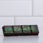 Unwrapped Winfield's Dark Chocolate Dubai Bar showing the green pistachio and kataifi filling