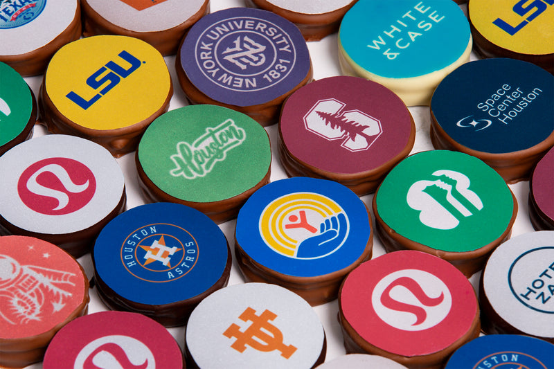 Winfield's chocolate-covered Oreos laid out in rows, each printed with a client logo in full colour