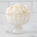 Scoops of Winfield's Lemon Velvet ice cream in a footed glass dish