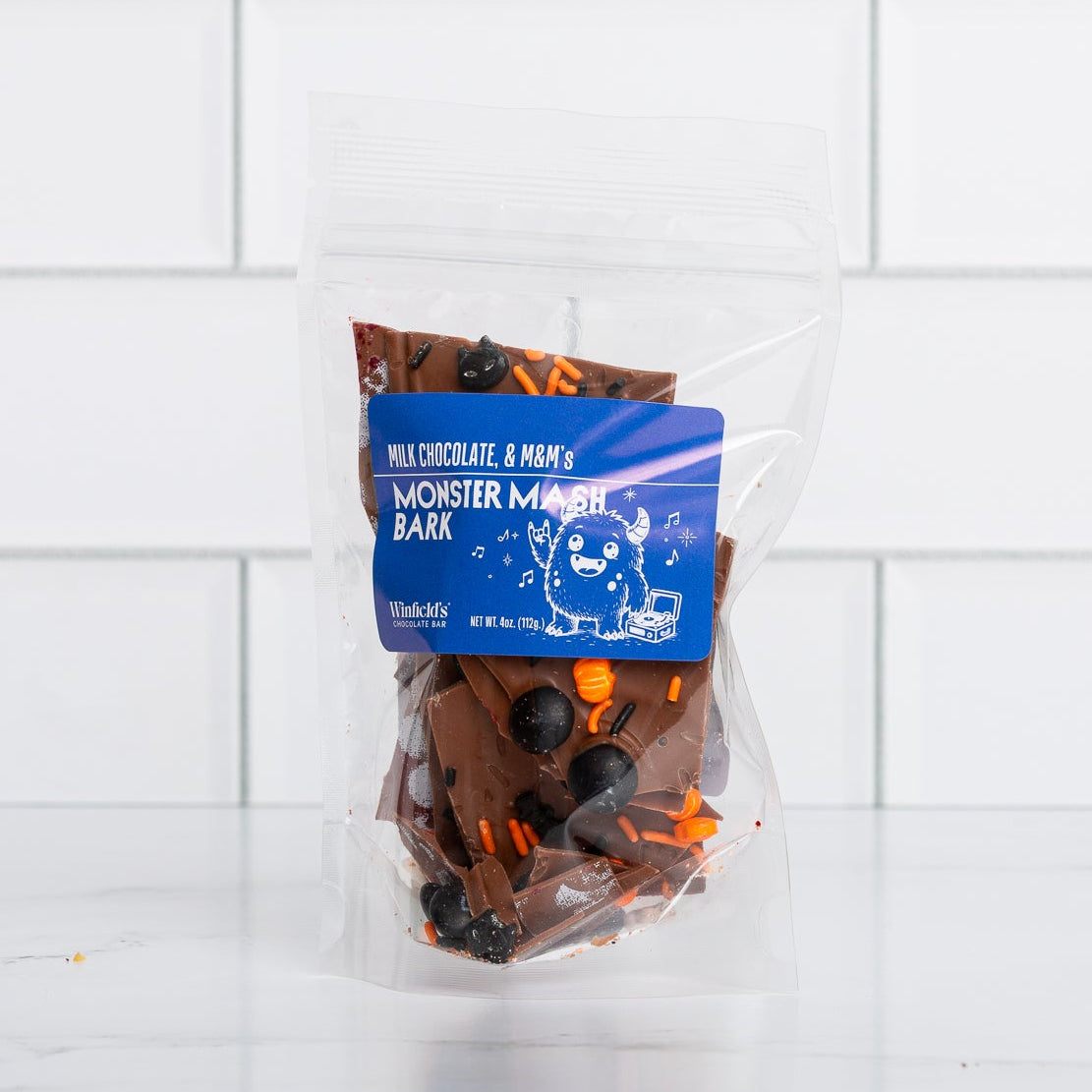 Winfield's Monster Mash Bark: milk chocolate bark with M&M's and Halloween sprinkles