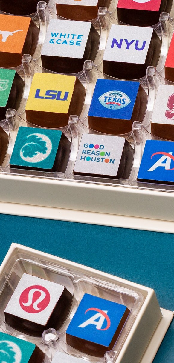 Custom chocolates printed with client logos in Winfield's gift boxes