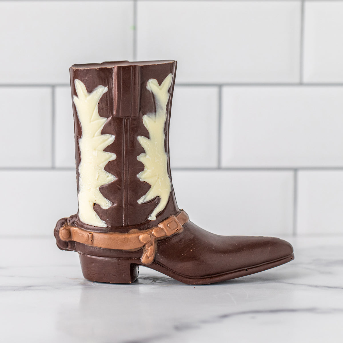 Winfield's molded chocolate cowboy boot in milk and white chocolate with decorative stitching