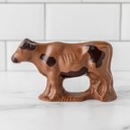 Winfield's milk chocolate cow with dark chocolate markings, side view